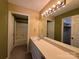 Well-lit bathroom with a wide mirror above the vanity, a shower/tub combo, and a connected closet at 1590 Springpoint Rd # B, Rock Hill, SC 29732