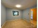 Bedroom includes neutral walls, tile flooring, and natural light from the window at 1590 Springpoint Rd # B, Rock Hill, SC 29732