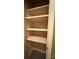 A linen closet features wooden shelves that provides space for storing linens and organizing household items at 1590 Springpoint Rd # B, Rock Hill, SC 29732