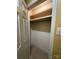 Walk-in closet with built-in shelving units providing ample storage, and neutral tile flooring at 1590 Springpoint Rd # B, Rock Hill, SC 29732