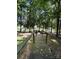 Wooden walkway through a grove of trees leads to the lake and a private dock at 1590 Springpoint Rd # B, Rock Hill, SC 29732