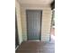 Image of a gray six panel door and light brown wood planks on a porch at 1590 Springpoint Rd # B, Rock Hill, SC 29732