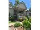Inviting condo featuring a covered entrance, well-maintained landscaping, and a blend of natural light at 1590 Springpoint Rd # B, Rock Hill, SC 29732
