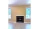 Close up of fireplace with tile flooring, flanked by windows providing ample natural light and scenic views at 1590 Springpoint Rd # B, Rock Hill, SC 29732