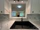 A kitchen sink has a pass through to the living room of the house at 1590 Springpoint Rd # B, Rock Hill, SC 29732