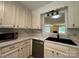 An opening over the kitchen sink looks into the living area and provides natural light at 1590 Springpoint Rd # B, Rock Hill, SC 29732