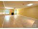 Spacious living room features tile flooring, a cozy fireplace, and plenty of natural light from the windows at 1590 Springpoint Rd # B, Rock Hill, SC 29732