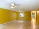 Open-concept living room showcases tile flooring, natural light, a ceiling fan, and a glimpse into the kitchen at 1590 Springpoint Rd # B, Rock Hill, SC 29732