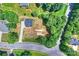 Aerial view of the property showing the house, driveway, and surrounding land and neighborhood at 164 Meadow Glen Dr, Troutman, NC 28166