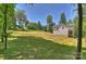 Spacious backyard with lush grass and a view of the back of the home at 164 Meadow Glen Dr, Troutman, NC 28166