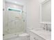 A luxurious bathroom features a walk-in shower with marble tile and a vanity with a marble countertop at 164 Meadow Glen Dr, Troutman, NC 28166
