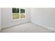 Bright bedroom featuring a large window and plush carpeting at 164 Meadow Glen Dr, Troutman, NC 28166
