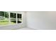 Bright bedroom with a large window view to green, lush trees outside at 164 Meadow Glen Dr, Troutman, NC 28166