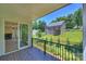 Charming deck offers views of the landscaped yard and nearby stream at 164 Meadow Glen Dr, Troutman, NC 28166