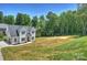 Two-story home offering a mix of lush landscaping and greenery, nestled in a peaceful and serene environment at 164 Meadow Glen Dr, Troutman, NC 28166
