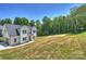 New two-story home with lush surroundings offering a blend of modern living and natural serenity in a picturesque setting at 164 Meadow Glen Dr, Troutman, NC 28166