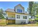 Rear exterior of home with walkout basement and deck at 164 Meadow Glen Dr, Troutman, NC 28166