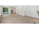 Bright living room featuring hardwood floors and access to the kitchen and outdoor patio at 164 Meadow Glen Dr, Troutman, NC 28166