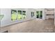 Spacious open-concept living space boasts plenty of light with views through large windows at 164 Meadow Glen Dr, Troutman, NC 28166