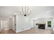 Open living area with fireplace and views from lots of bright windows at 164 Meadow Glen Dr, Troutman, NC 28166