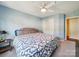 Light and airy bedroom featuring a comfortable bed, closet and an ensuite doorway at 16411 Greybriar Forest Ln, Charlotte, NC 28278