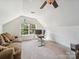 Sunlit bonus room offering a comfortable workspace, ideal for productivity at 16411 Greybriar Forest Ln, Charlotte, NC 28278