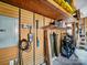 Well-organized garage space with EV charger, shelves and pegboard for optimal storage at 16411 Greybriar Forest Ln, Charlotte, NC 28278