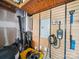 Garage featuring an EV charger, on-demand water heater, and pegboard walls for organizing equipment at 16411 Greybriar Forest Ln, Charlotte, NC 28278