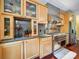 Well-equipped kitchen with stainless steel appliances, granite countertops, and custom wood cabinetry at 16411 Greybriar Forest Ln, Charlotte, NC 28278
