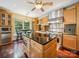 Spacious kitchen with granite countertops, stainless steel appliances, and dark wood floors for a modern, elegant feel at 16411 Greybriar Forest Ln, Charlotte, NC 28278
