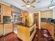 Modern kitchen featuring stainless steel appliances, a central island, granite counters and wood cabinets at 16411 Greybriar Forest Ln, Charlotte, NC 28278