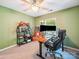 This cozy office space has green walls, a computer and shelving at 16411 Greybriar Forest Ln, Charlotte, NC 28278