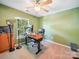 Bright office featuring a computer desk, natural light, and carpet floors at 16411 Greybriar Forest Ln, Charlotte, NC 28278