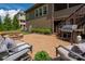 Backyard featuring a stone patio, outdoor grill, fire pit, and green space at 1805 Trading Path Ln, Waxhaw, NC 28173