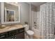 Bright bathroom with granite countertops, vanity mirror, and shower-tub combo at 1805 Trading Path Ln, Waxhaw, NC 28173