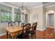 Cozy dining room with wood floors and a chandelier with plenty of natural light at 1805 Trading Path Ln, Waxhaw, NC 28173