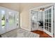 Bright foyer with hardwood floors and a view into the adjacent office space through French doors at 1805 Trading Path Ln, Waxhaw, NC 28173