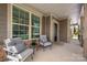 Inviting front porch with comfortable seating, perfect for relaxing and enjoying the neighborhood views at 1805 Trading Path Ln, Waxhaw, NC 28173