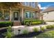 Beautifully landscaped front yard with lush greenery, colorful flowers, and a brick-paved walkway at 1805 Trading Path Ln, Waxhaw, NC 28173