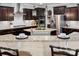 Modern kitchen with stainless steel appliances, granite countertops, and pendant lighting at 1805 Trading Path Ln, Waxhaw, NC 28173
