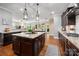 Spacious kitchen features a large island, stainless steel appliances, and hardwood floors at 1805 Trading Path Ln, Waxhaw, NC 28173