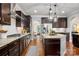 Beautiful kitchen featuring stainless steel appliances, granite countertops, and hardwood floors at 1805 Trading Path Ln, Waxhaw, NC 28173