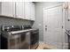 This laundry room features stainless steel appliances and ample storage space at 1805 Trading Path Ln, Waxhaw, NC 28173