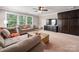 This living room boasts built-in storage, large windows, and neutral tones at 1805 Trading Path Ln, Waxhaw, NC 28173