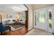Elegant living room featuring hardwood floors, a stylish rug, and comfortable seating at 1805 Trading Path Ln, Waxhaw, NC 28173