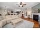 Open-concept living room with fireplace, hardwood floors, and great natural light at 1805 Trading Path Ln, Waxhaw, NC 28173