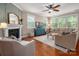 Comfortable living room with fireplace, large windows, and hardwood flooring at 1805 Trading Path Ln, Waxhaw, NC 28173