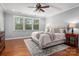 Serene primary bedroom with hardwood floors, tray ceiling, and natural light at 1805 Trading Path Ln, Waxhaw, NC 28173