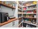 Spacious pantry with custom shelving, ample storage, and wood countertops at 1805 Trading Path Ln, Waxhaw, NC 28173