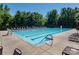 Large community pool with lounge chairs and seating areas at 1805 Trading Path Ln, Waxhaw, NC 28173
